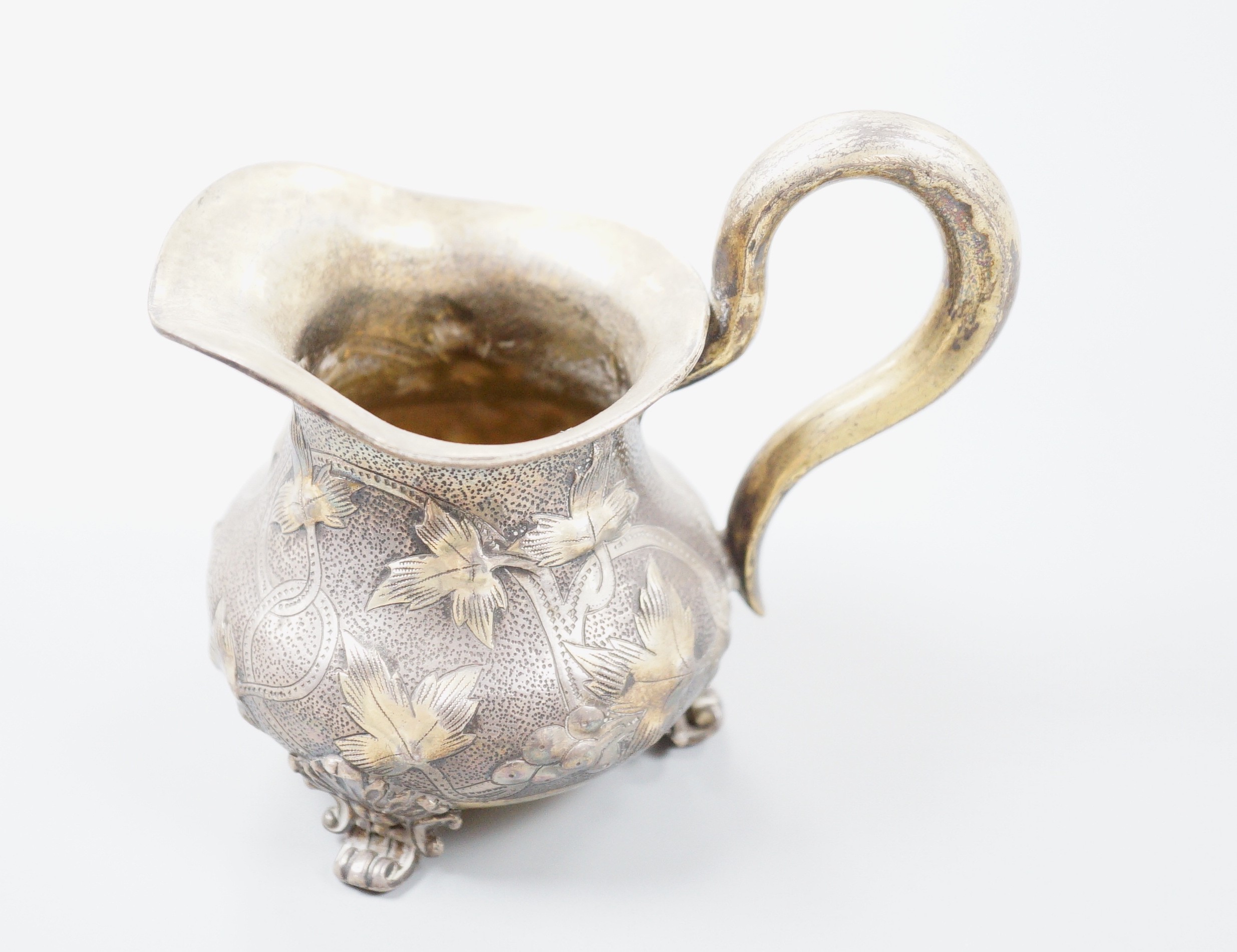 A 19th century Russian gilt white metal cream jug, indistinct marks, 94mm, 109 grams.